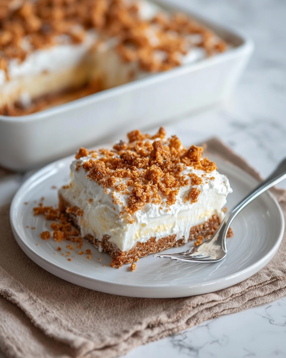 The image shows a close-up of a dessert being lifted from a clear glass baking dish. The dessert has three visible layers: a crunchy light brown crumbly base, a thick middle layer of smooth white cream, and a top layer sprinkled with more crunchy light brown crumbs mixed with white powdered sugar dusting. The texture of the crumbs looks rough and uneven, while the cream is soft and smooth. The background is a white marbled surface, and a silver spatula holding the dessert slice is partly visible. Photo taken with an iphone --ar 4:5 --v 7