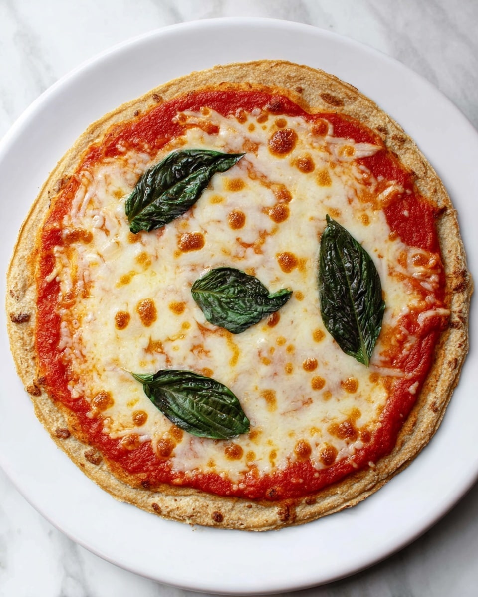 The image shows three slices of cheese pizza with tomato sauce and fresh spinach leaves on top, placed on a white plate. Each slice has a pale golden-brown crust with a rough texture, a layer of red tomato sauce near the crust edge, a thick smooth layer of melted white cheese with slight golden spots, and a single dark green spinach leaf centered on each slice. The plate sits on a white marbled surface. photo taken with an iphone --ar 4:5 --v 7